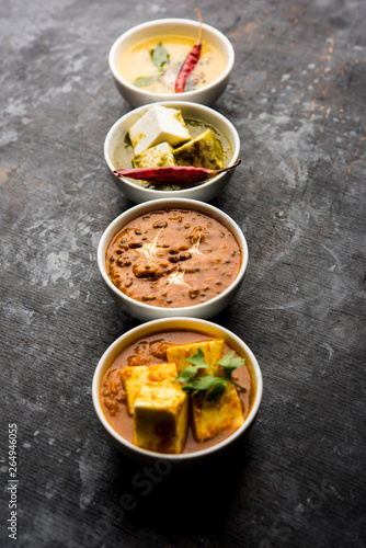 Palak paneer butter masala, yellow dal or dal-makhani served in a bowl in a group. selective focus