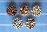 Healthy food. Nuts mix assortment on stone texture top view. Collection of different legumes for background image close up nuts, pistachios, almond, cashew nuts, peanut, walnut. image