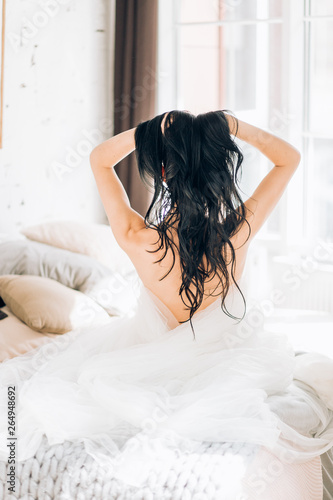 Boudoir portrait of beautiful bride. Bride wedding morning.