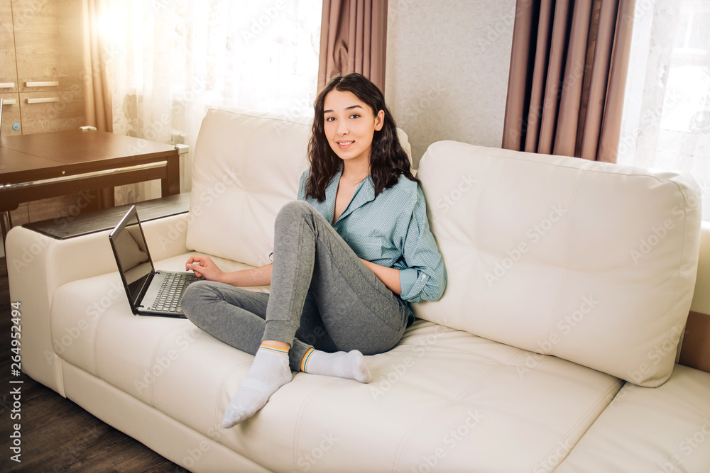 Bbeautiful woman using laptop computer at home on sofa Bbeautiful woman using laptop computer at home on sofa