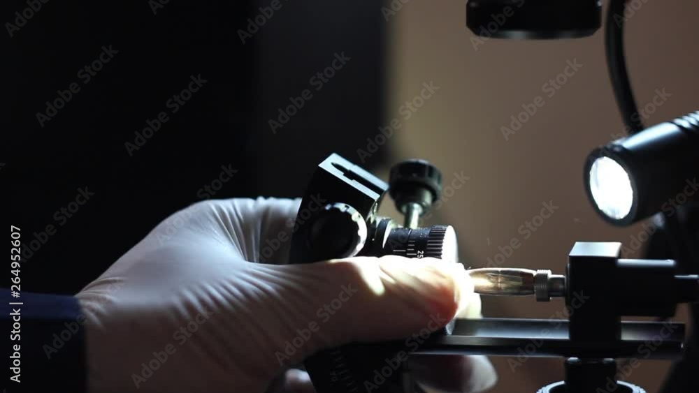 Criminal Police Laboratory, close-up microscopic examination of bullet ...