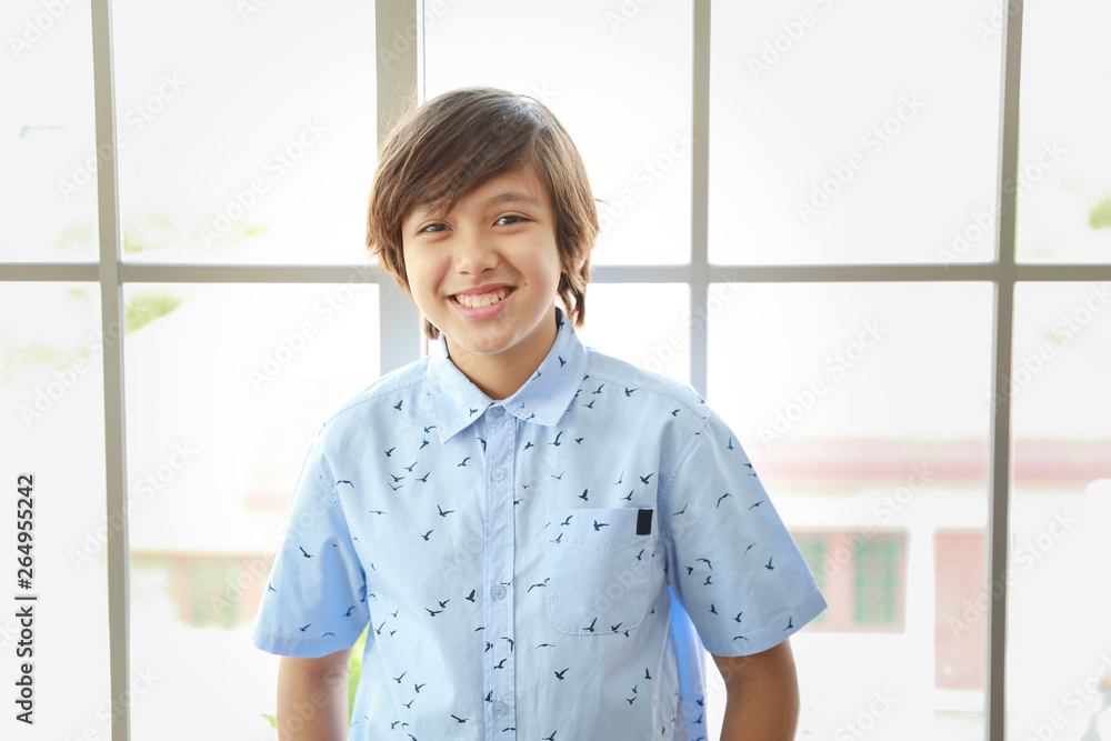 portrait of cute little student boy standing in blue shirt with happy smiling face portrait of cute little student boy standing in blue shirt with happy smiling face