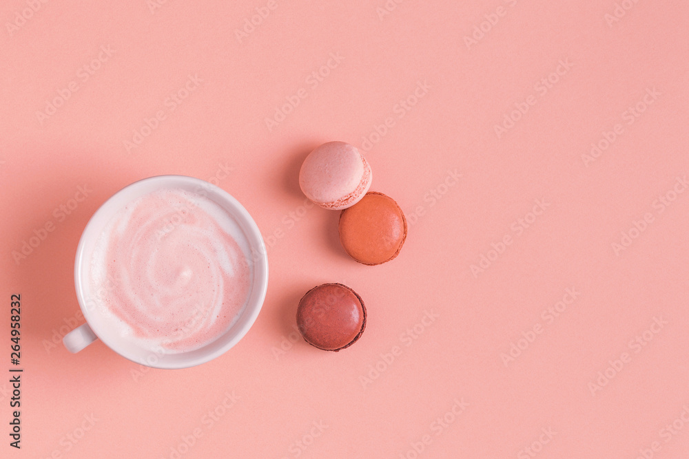 Cup of coffee with macaroons on pastel background. Cup of coffee with macaroons on pastel background.