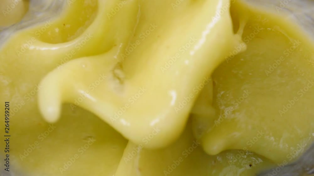 Making fresh fruits shake in blender. Pineapple ananas fruit slices mixing in slow motion. Close up top view. Healthy food, dieting Making fresh fruits shake in blender. Pineapple ananas fruit slices mixing in slow motion. Close up top view. Healthy food, dieting