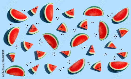 Fototapeta Naklejka Na Ścianę i Meble -  Sliced watermelons arranged on a blue background