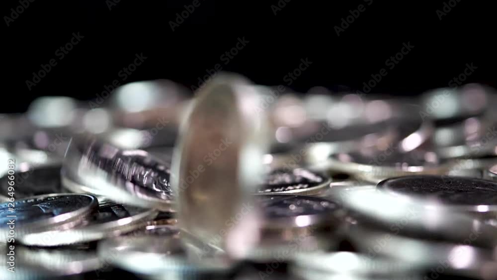 Slow motion close up falling coin on black background (Thai currency, THB coin) Slow motion close up falling coin on black background (Thai currency, THB coin)