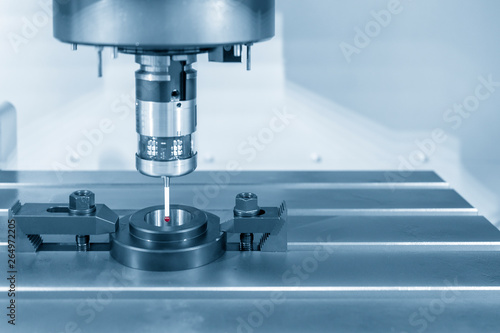 The touch probe attach on the CNC milling machine for calibration process with ring gage. The CMM measuring process.