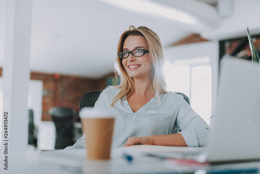 Relaxed woman in the armchair at her office workplace Relaxed woman in the armchair at her office workplace