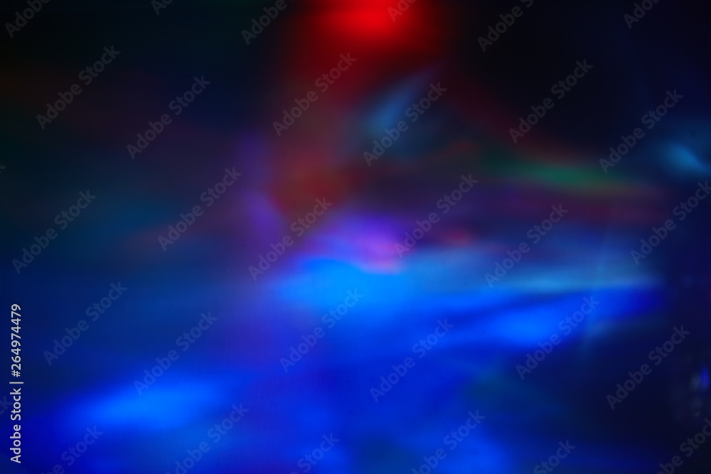 Blurry spots of light in green, blue, white and red Blurry spots of light in green, blue, white and red