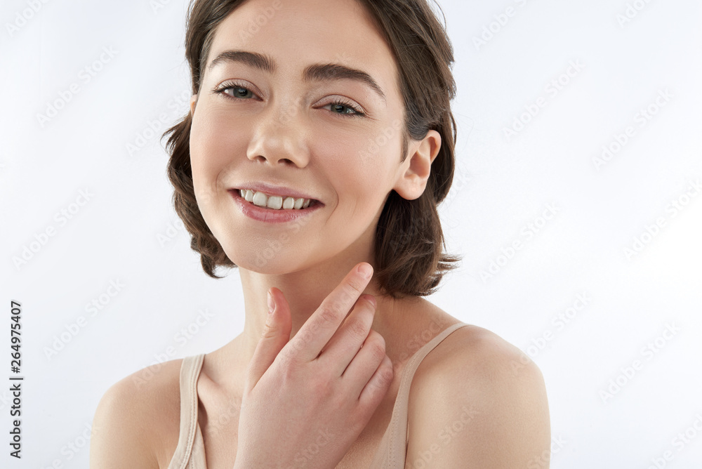 Young smiling tender brunette female on white Young smiling tender brunette female on white
