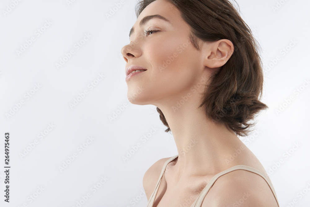 Side on of pretty brunette female on white Side on of pretty brunette female on white