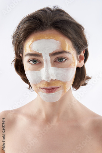 Pretty smiling brunette woman with face mask