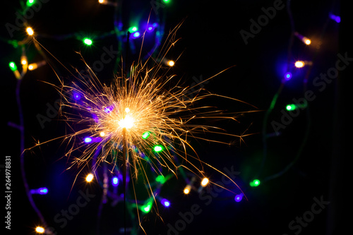 sparkler with blur new year s light close up