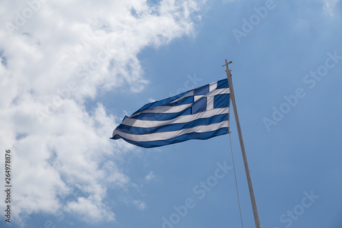 greek flag waving on blue sky clouds greece photo