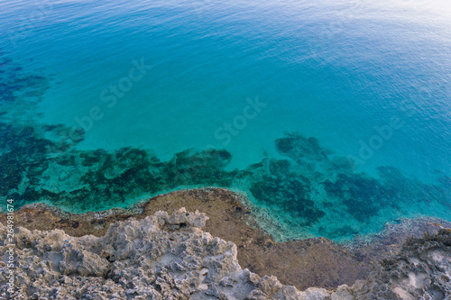 Aerial beach at sunset. crystal turquoise water sea. italy coastline