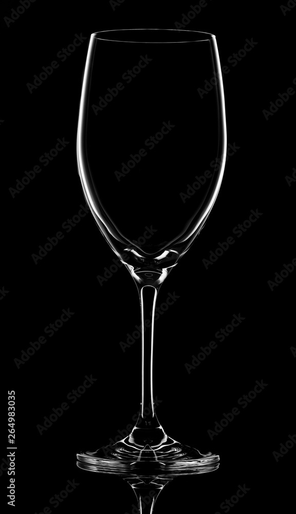 Empty wineglass on black background