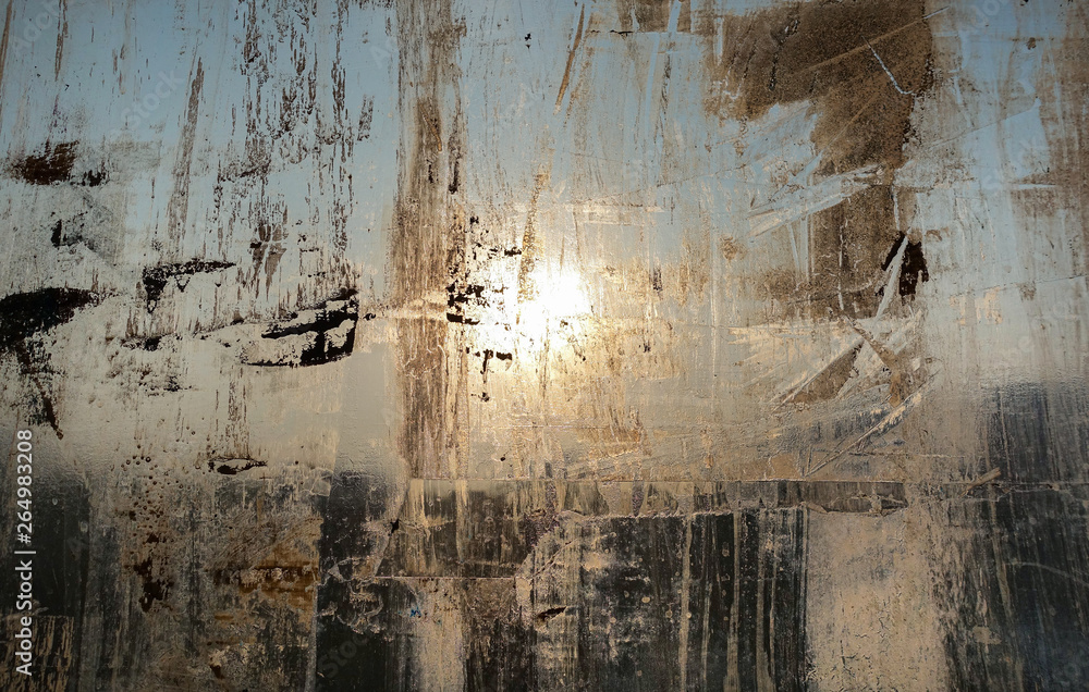 Fototapeta premium Abstract background. Window chaotically smeared with paint, illuminated by the sun.