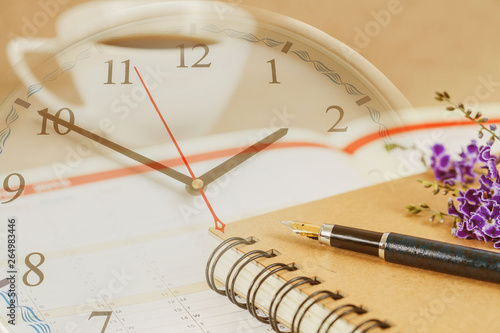 Wallpaper Mural personal organizer or planner with fountain pen and hot coffee on wood table. Torontodigital.ca