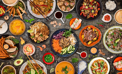 Asian food background with various ingredients on rustic stone background , top view.