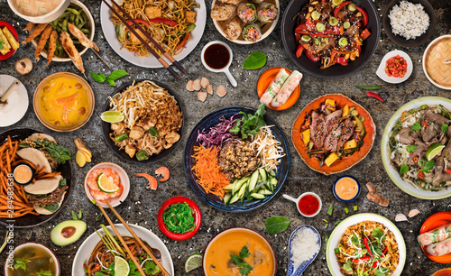 Asian food background with various ingredients on rustic stone background , top view.