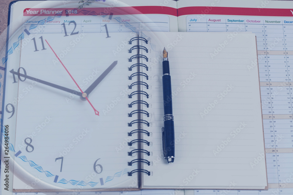 personal organizer or planner with fountain pen on clock personal organizer or planner with fountain pen on clock