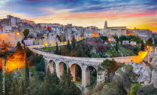 Gravina in Puglia ancient town, bridge and canyon at sunrise. Panoramic view of old city Gravina in Puglia, Apulia, Italy. Europe photo