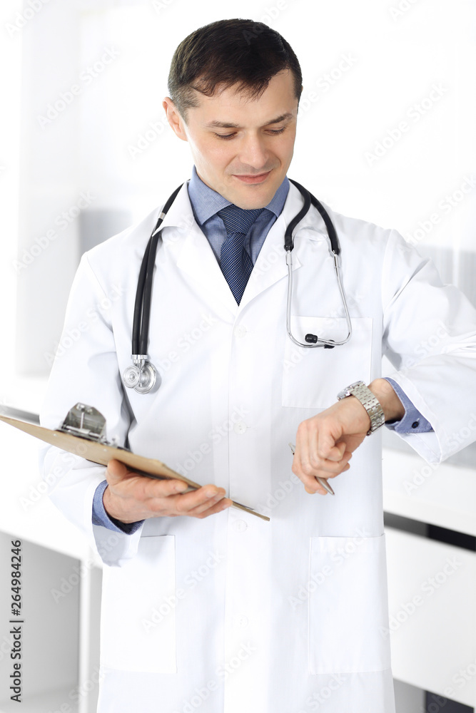 Doctor man using clipboard for filling up medication history records. Perfect medical service in clinic. Physician at work in hospital. Medicine and healthcare concepts Doctor man using clipboard for filling up medication history records. Perfect medical service in clinic. Physician at work in hospital. Medicine and healthcare concepts