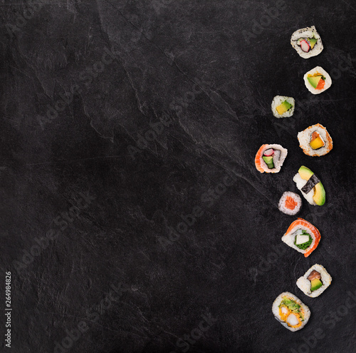 Japanese sushi set on black stone background