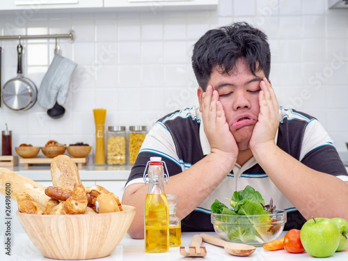 fat man try to eat healthy food