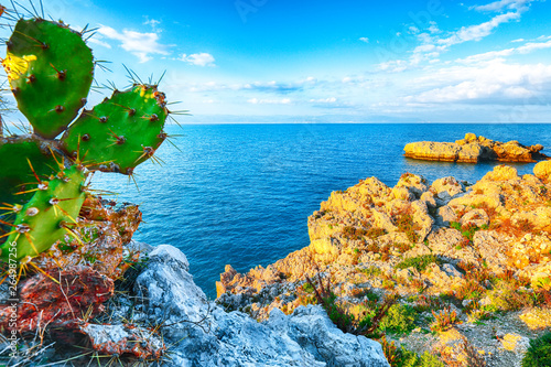Dramatic spring sunset on the the cape Milazzo panorama of nature reserve Piscina di Venere.