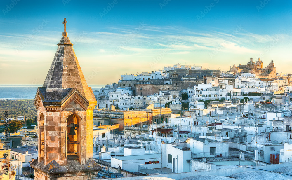 View of old town white town Ostuni and cathedral at sunrise.
