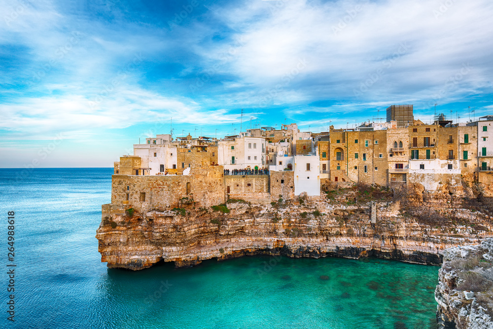 Polignano a Mare village on the rocks at sunset