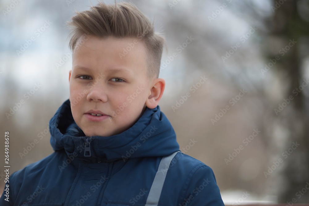 Portrait of a child on a city street. Portrait of a child on a city street.