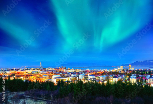 View of the northern light from the city center in Reykjavik, Iceland.