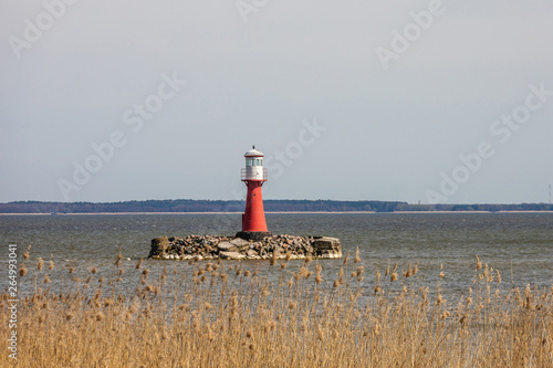 In Lithuania, Pervalka lighthouse stands in the middle of the sea photo