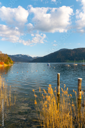 lake and boats in the mountains of Switzerland during evening and sunset photo