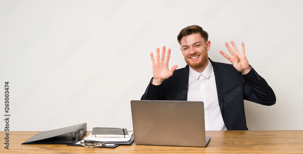 Businessman in a office counting nine with fingers Businessman in a office counting nine with fingers