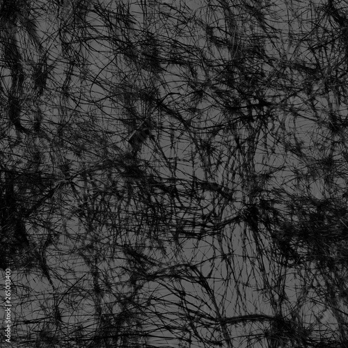 Web of black threads on a gray background