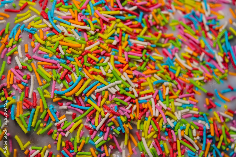 Multi-colored topping for confectionery texture close-up. Easter background.