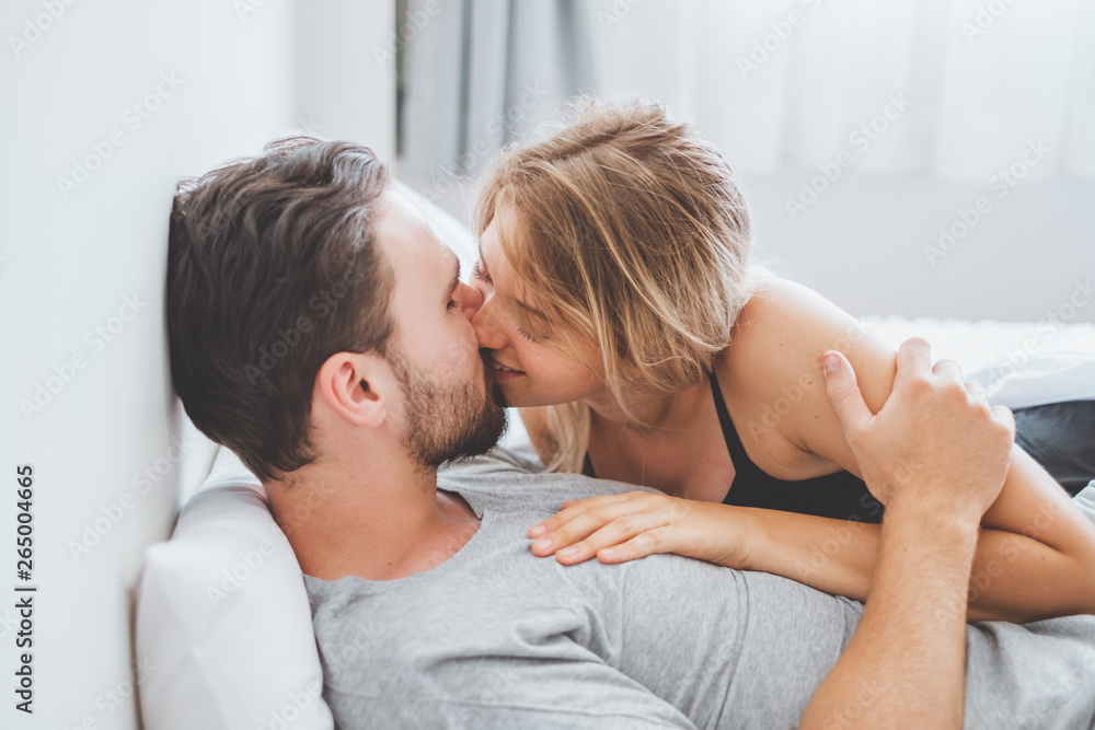 Happy couple lover on bed, hug and kiss in romantic time, love and