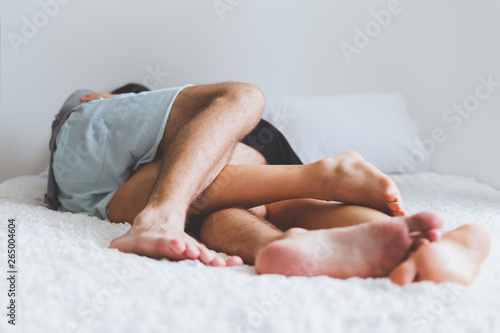 Happy couple lover on bed, hug and kiss in romantic time, love and passionate sex concept.