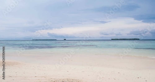 Time lapse: wind storm over tropical beach and sea dramatic sky moving clouds global warming climate change. Pulau Tailana, Banyak Islands, Sumatra, Indonesia. photo