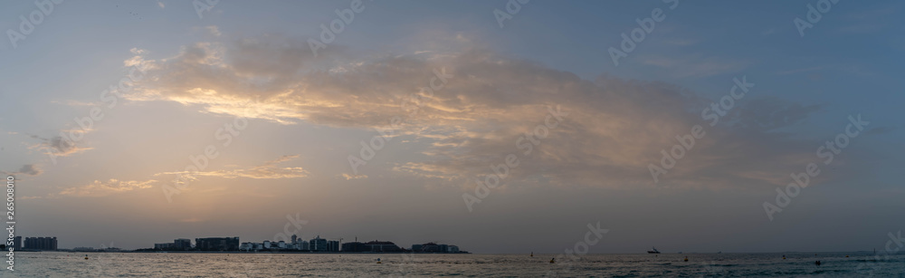dramatic evening cloudy sky and sunset view over Dubai, United Arab Emirates