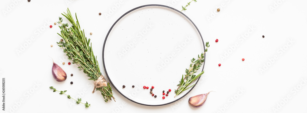 Empty plate with greens herbs and spices around - obrazy, fototapety, plakaty 