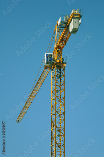 Wallpaper Mural lifting tower crane against the blue sky. Torontodigital.ca