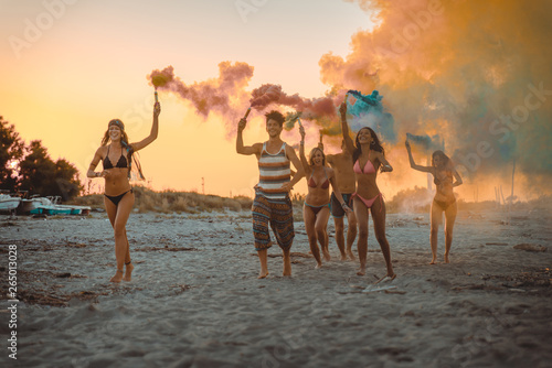 Group of friends partying at the beach