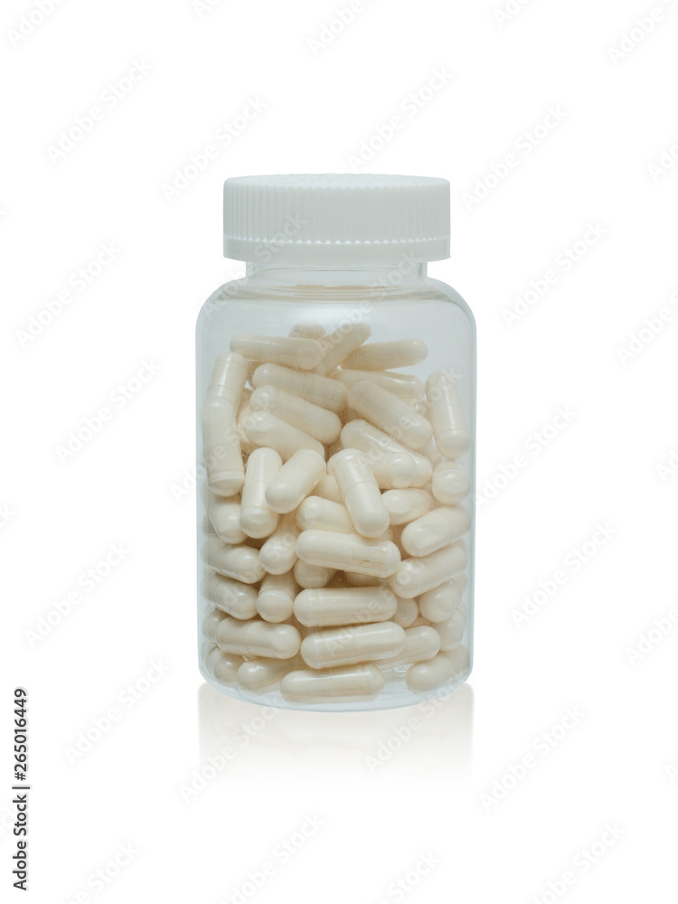 The closed plastic small bottle with capsules on a white background with a shadow The closed plastic small bottle with capsules on a white background with a shadow