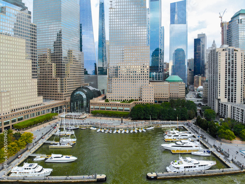 Aerial view Boats & ships docked at the North Cove Marina at Battery Park in Manhattan with Brookfield Place complex and offices buildings on the background. 