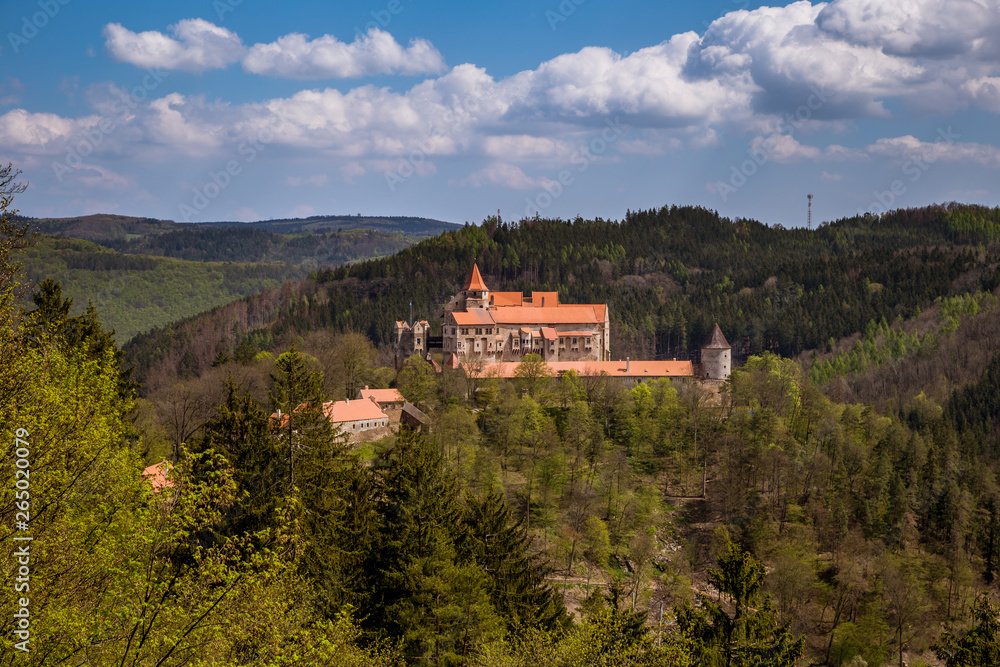 Pernstejn Castle stands in the woods on a high rock