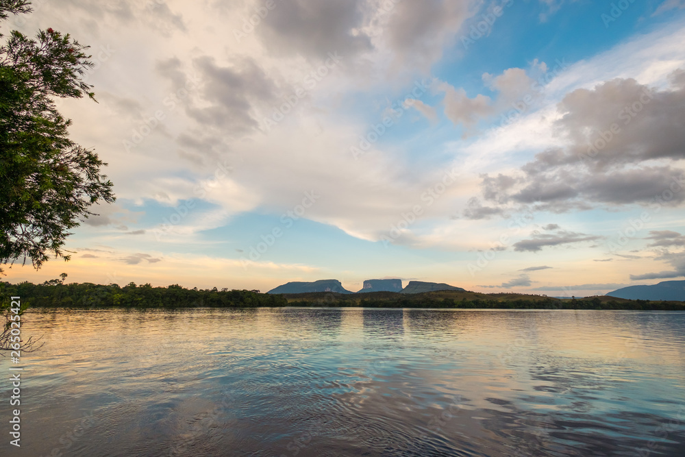 Small Tepuis standing across a River in Canaima during a beautiful sunrise, Venezuela